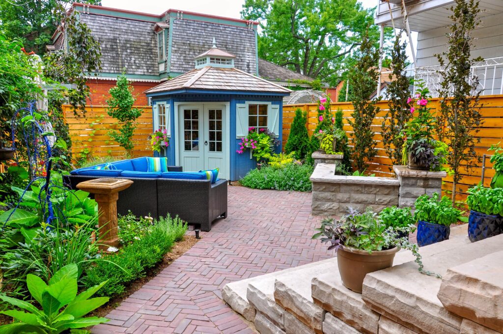 Landscaped backyard with pavers and planting